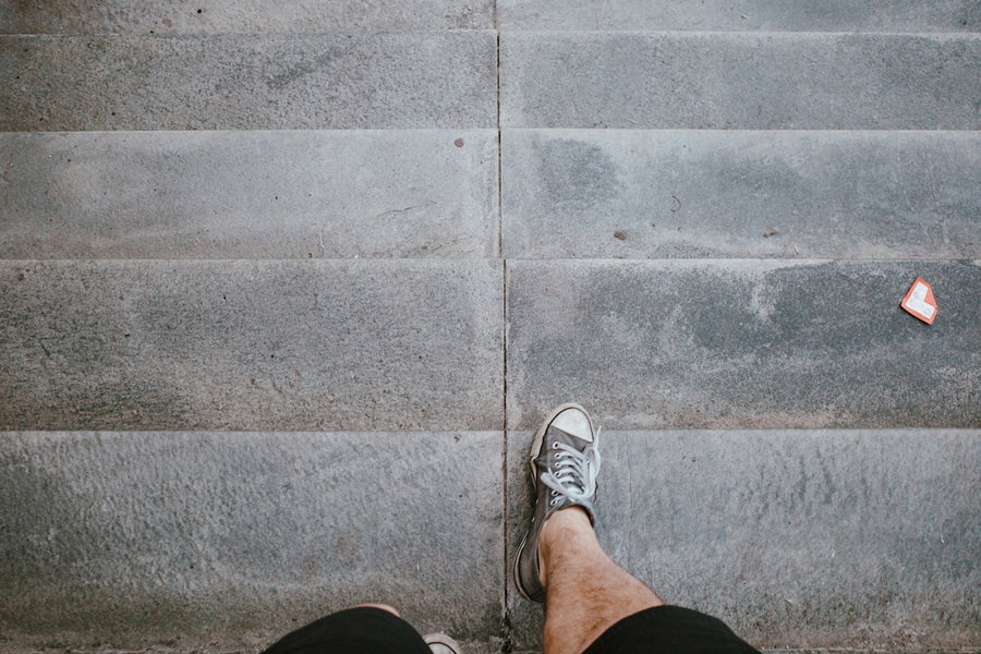 a person with their feet up on some steps
